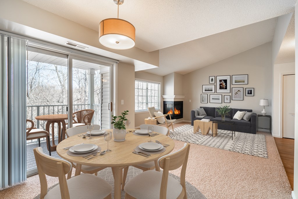 A dining room with a table set for six with a view of the backyard.