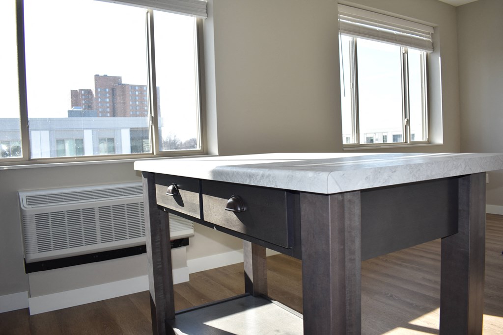 Movable island with marble-like countertops