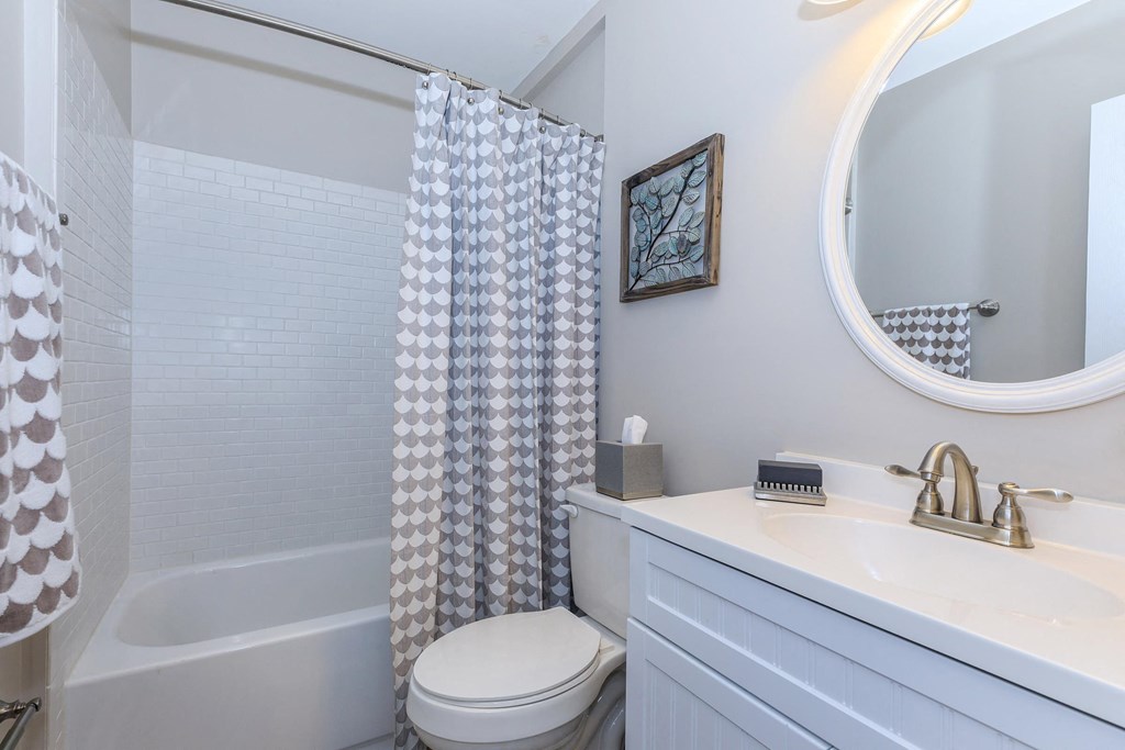 a bathroom with a shower and a toilet and a sink at Sawgrass Apartments, Charleston, South Carolina
