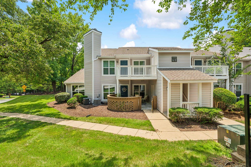 A house with a well-maintained lawn and a clear sky.at Chapel View, Chapel Hill, NC 27516