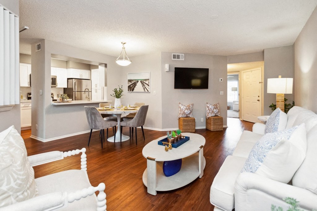 a living room and dining room with a couch and a table