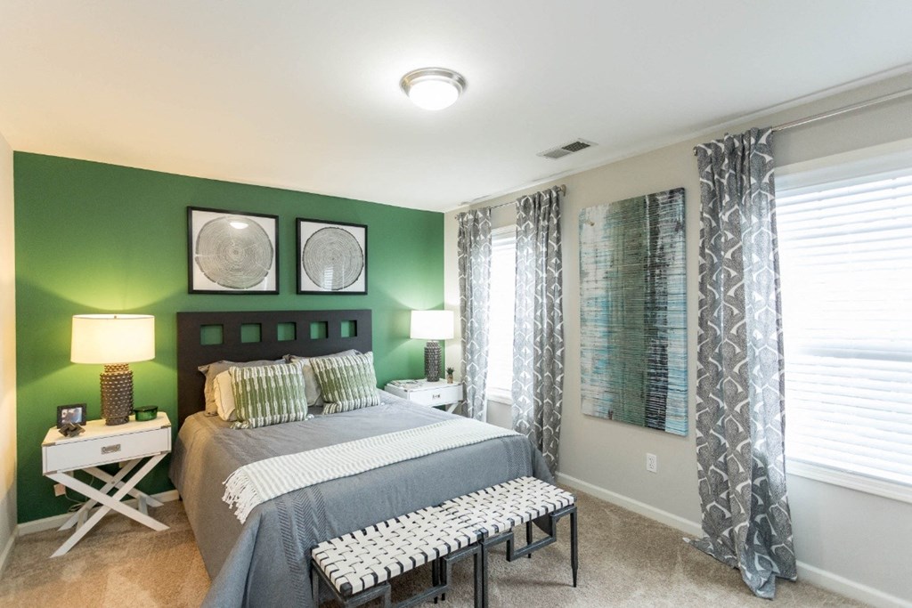 bedroom with green wall at The Resort At Lake Crossing Apartments, PRG Real Estate, Lexington, KY