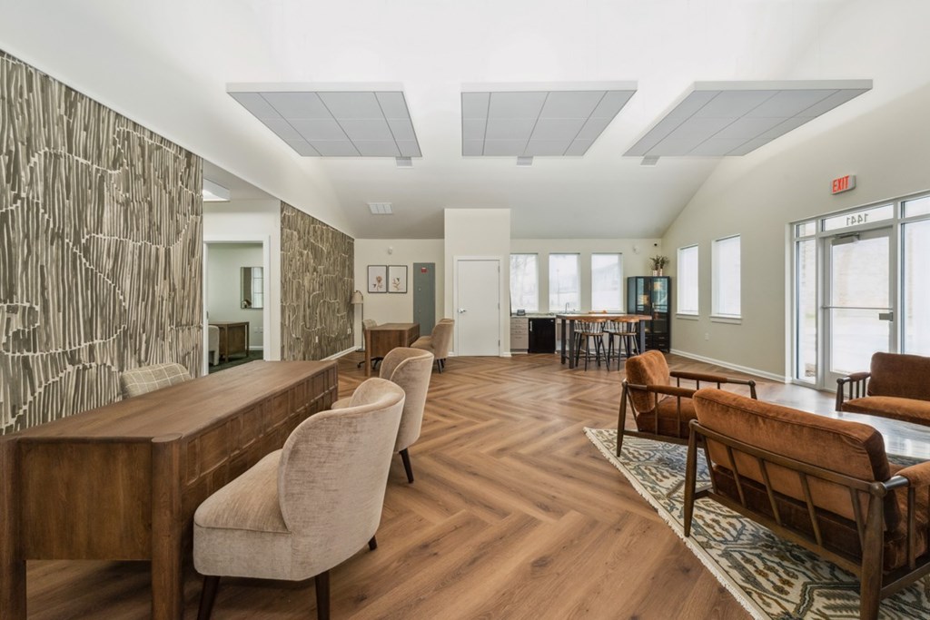 A room with a long wooden table and chairs at The Courtyards of Chanticleer Apartments, Virginia Beach, VA