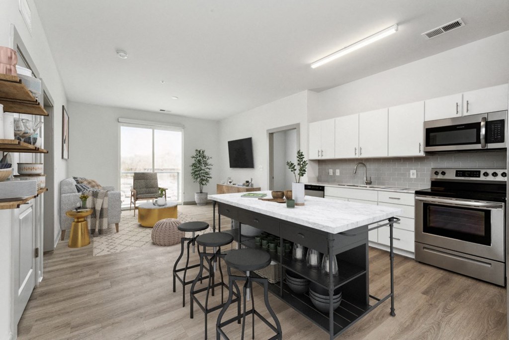 a kitchen and living room in an apartment