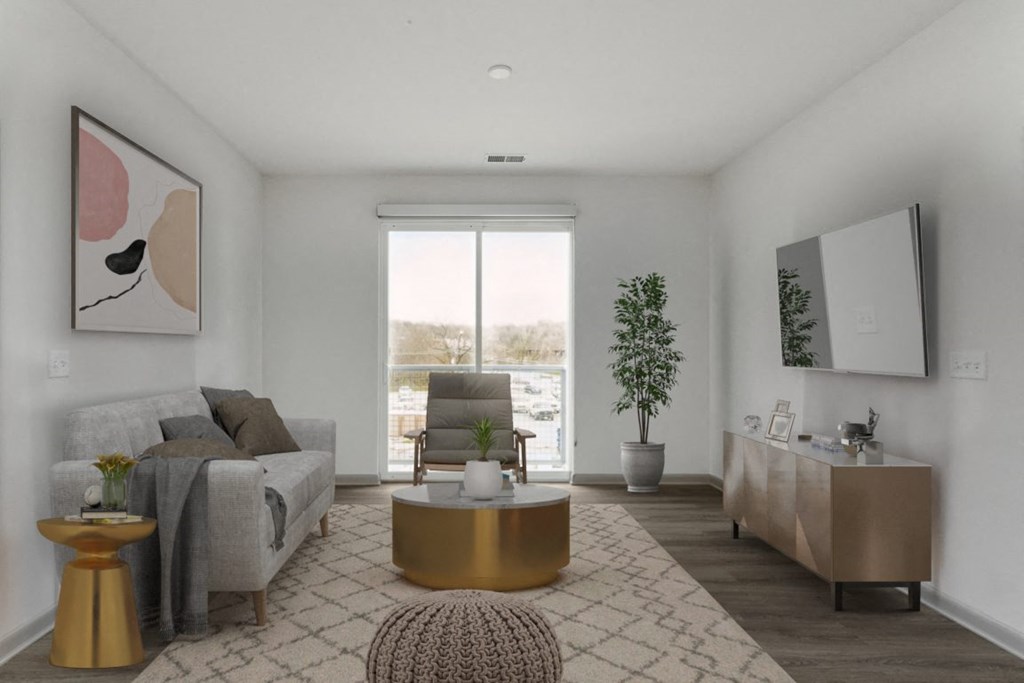 a living room with a couch and a chair in a 555 waverly unit