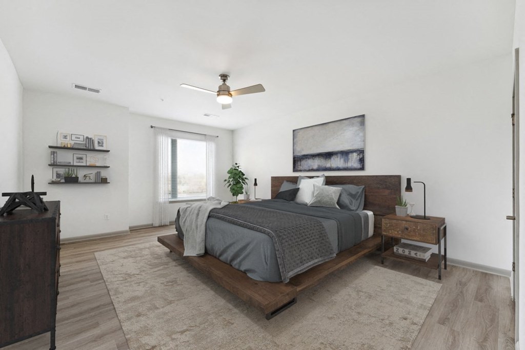 a bedroom with a large bed and white walls