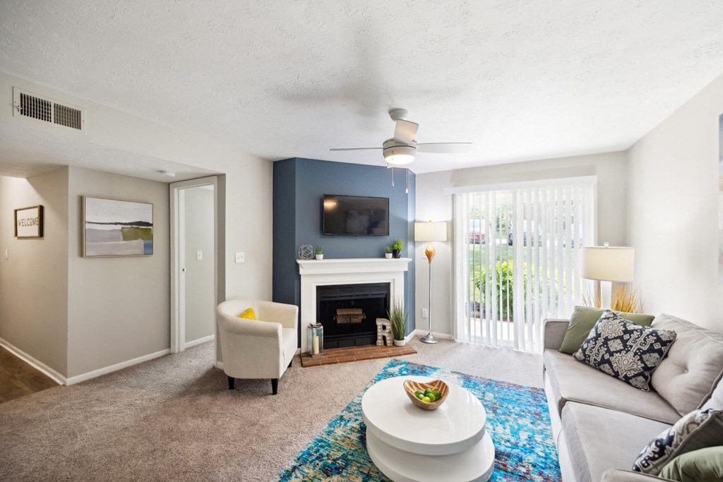 the preserve at ballantyne commons living room with fireplace and couch at River Oak Apartments, Kentucky, 40206