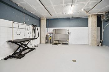 a large room with a sink and a machine in it  at The Box, Richmond