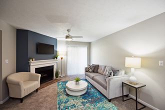 Living Room With Fireplace at River Oak Apartments, Louisville, KY