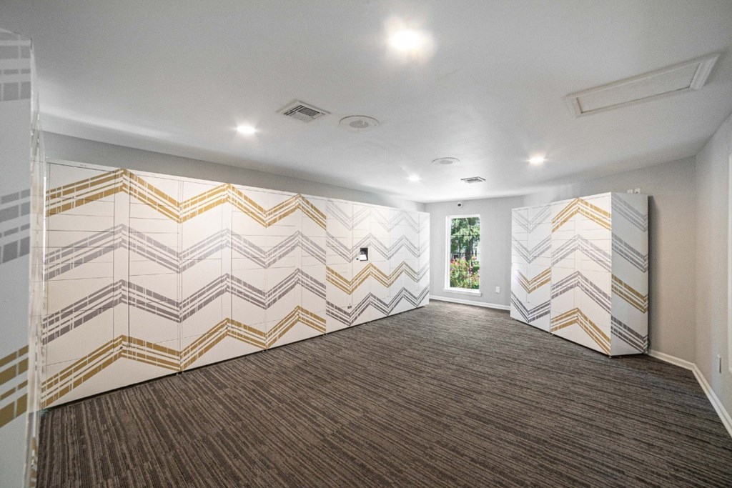 A room with a chevron patterned wallpaper and carpet at Willow Ridge Apartments, North Carolina, 28210