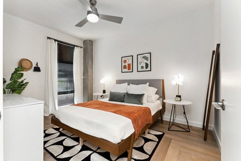 a bedroom with a bed and a ceiling fan at Hydro, Richmond