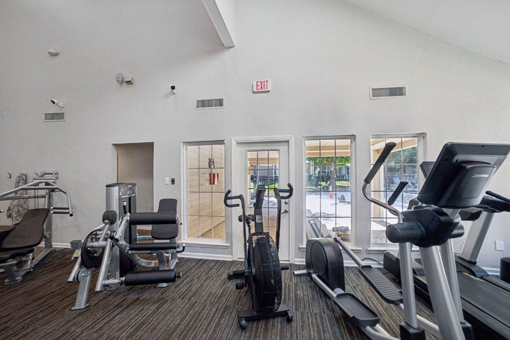 A gym with treadmills, weights and exercise machines at Willow Ridge Apartments, North Carolina, 28210