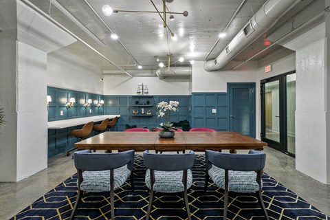 A dining room with a wooden table and chairs at The Carousel Apartments, Richmond, Virginia