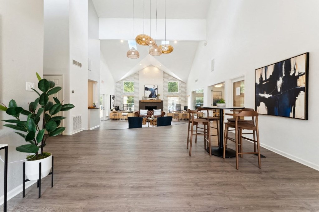 the gathering place at gardner village community room with white walls and wood flooring  at Willow Ridge Apartments, Charlotte, NC