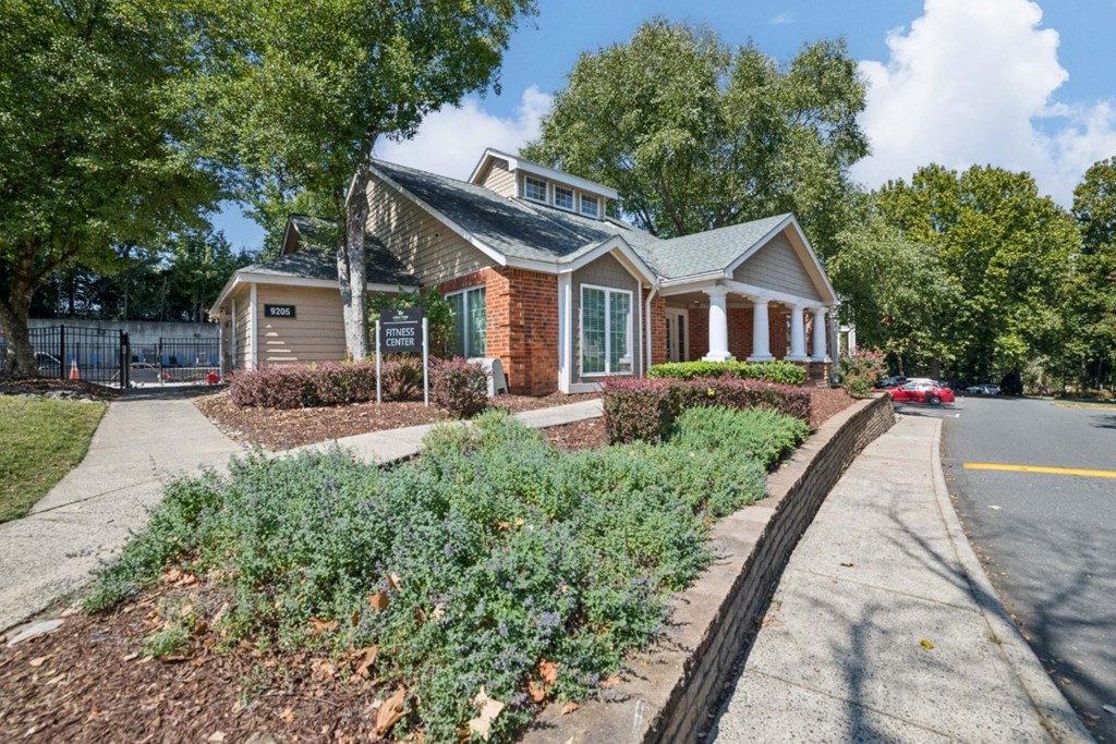 A house with a red car parked in front at Willow Ridge Apartments, North Carolina, 28210