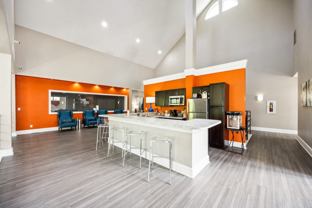 the preserve at ballantyne commons clubhouse with kitchen and living room at River Oak Apartments, Louisville, KY, 40206