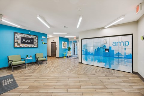 Amp logo on a blue wall in a waiting room.