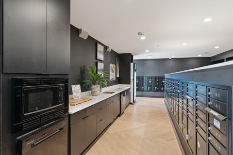 A modern kitchen with black cabinets and wooden countertops.