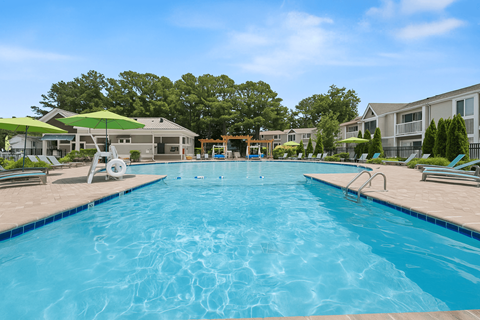 A large swimming pool in a sunny outdoor setting. at Linkhorn Bay Apartments, Virginia Beach, VA, 23451