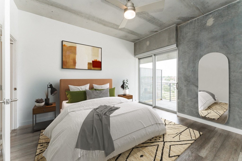 Bedroom with Bed and a Mirror at South Falls Tower, Richmond, VA