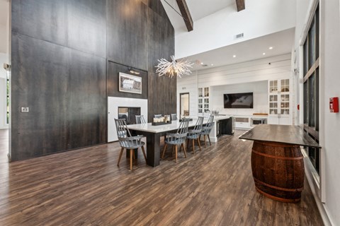 a dining room with a table and chairs and a fireplace at Beckett Farms Apartments, PRG Real Estate Management, Fort Mill, 29715