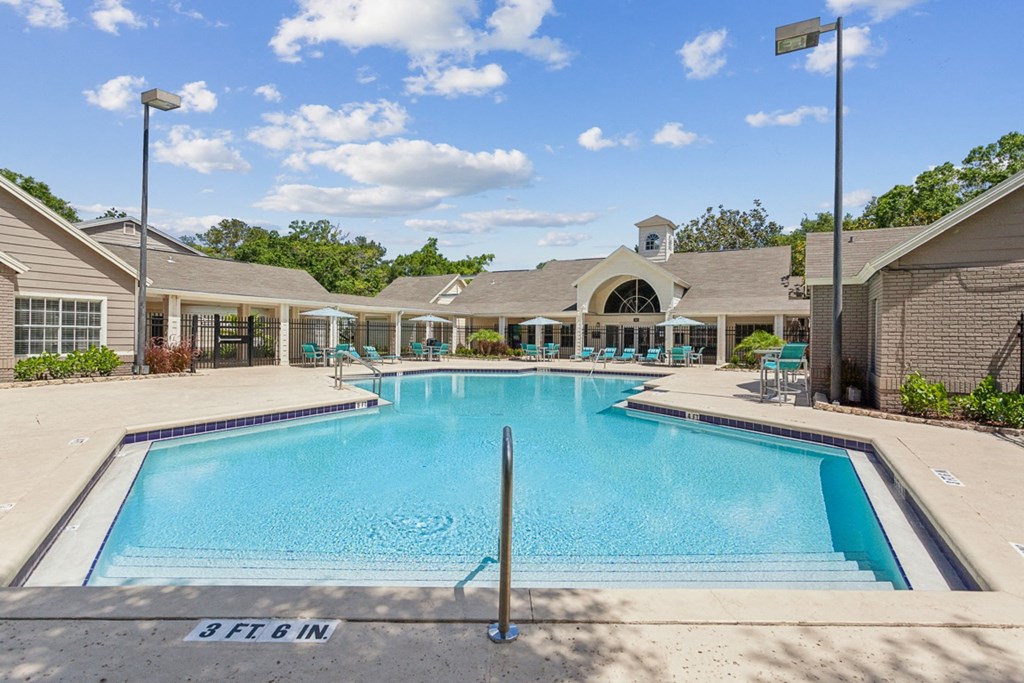 the preserve at ballantyne commons pool and resort style building with a swimming pool  at Palm Crossing, Winter Garden