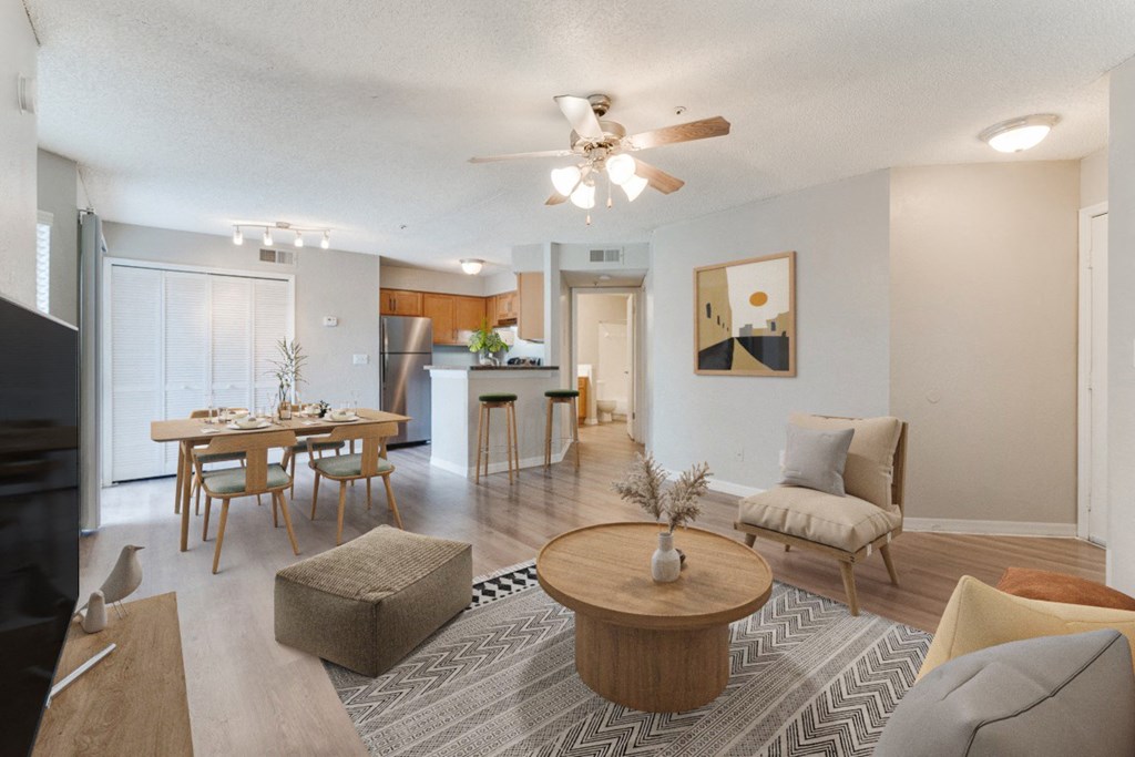 Living Room with beige accents at Palm Crossing Apartments in Winter Garden, FL