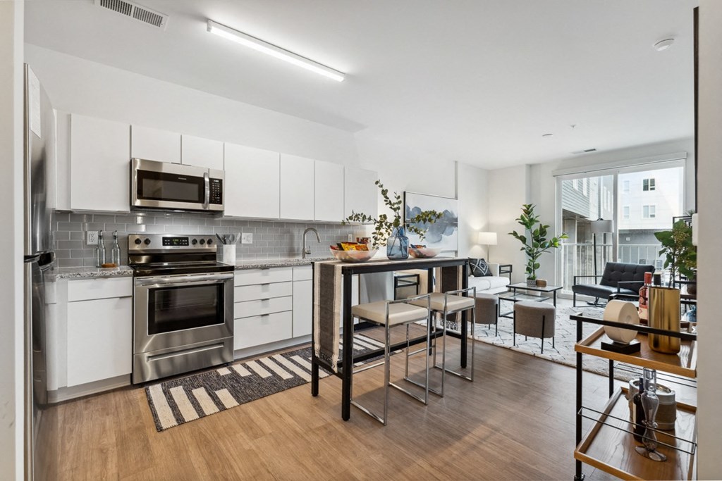 a kitchen with white cabinetry and stainless steel appliances at The Constellation Apartments, PRG Real Estate, Hampton, Virginia