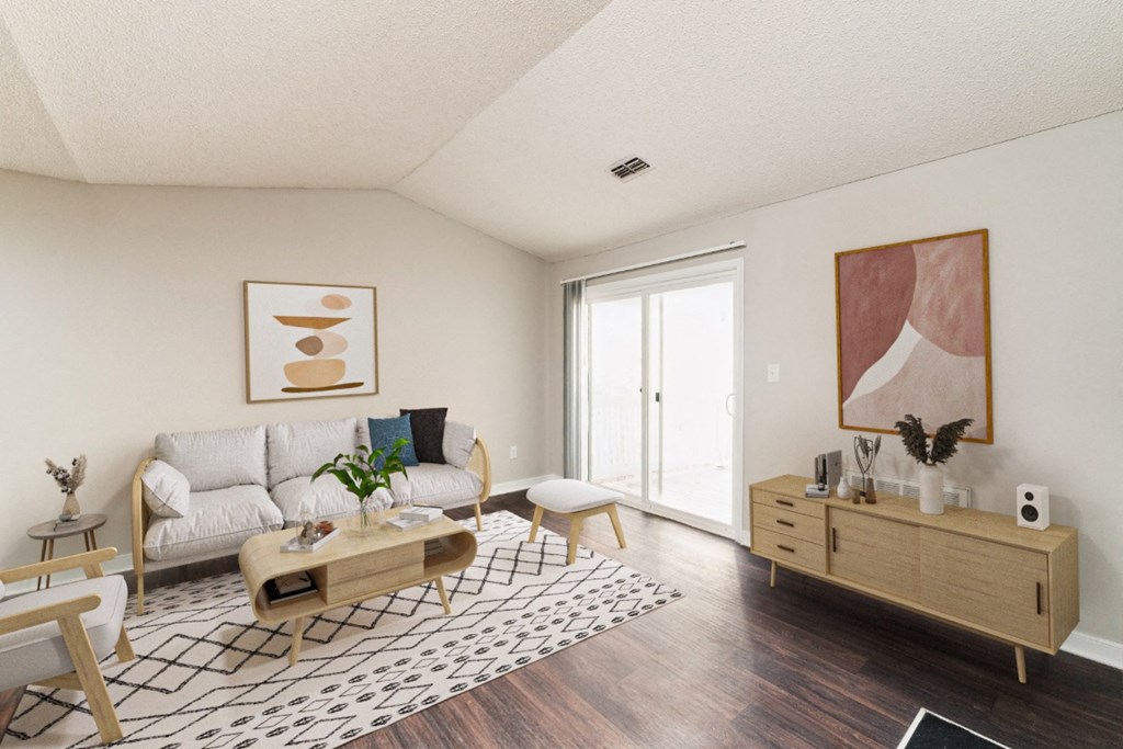 an open living room with a couch and a table
