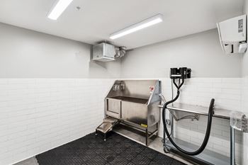 a commercial kitchen with a large stainless steel sink and at Hydro, Richmond, VA