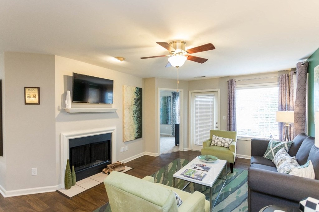 Living room with fireplace at The Resort At Lake Crossing Apartments, PRG Real Estate, Lexington, KY