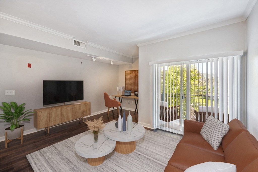 Living Room of an Apartment with a Couch and a Table at 45 Madison Apartments, Missouri, 64111
