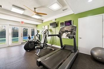 the gym in our apartments is equipped with a treadmill and tv at Ashton Creek, Chester, 23831