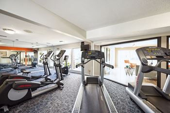 the gym at the is equipped with treadmills and ellipticals at The Grove at Lyndon, Louisville