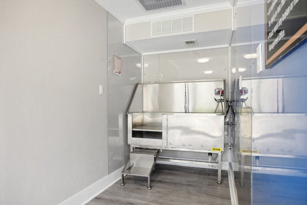 a patient room in a hospital with a bed in a glass door