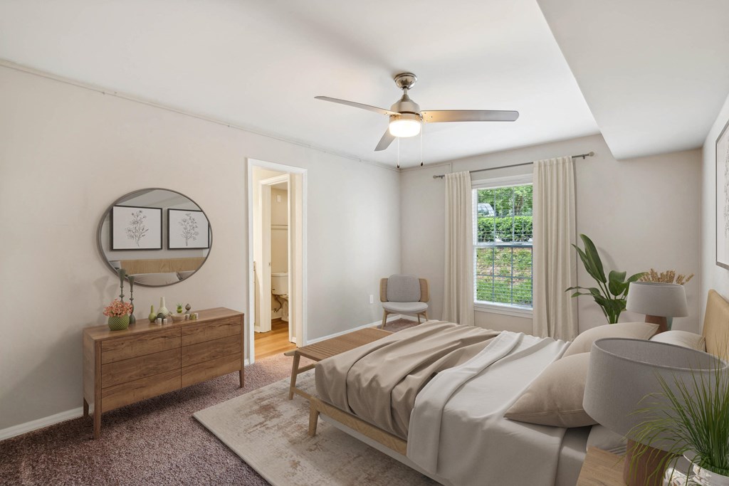 a bedroom with a bed and a ceiling fan