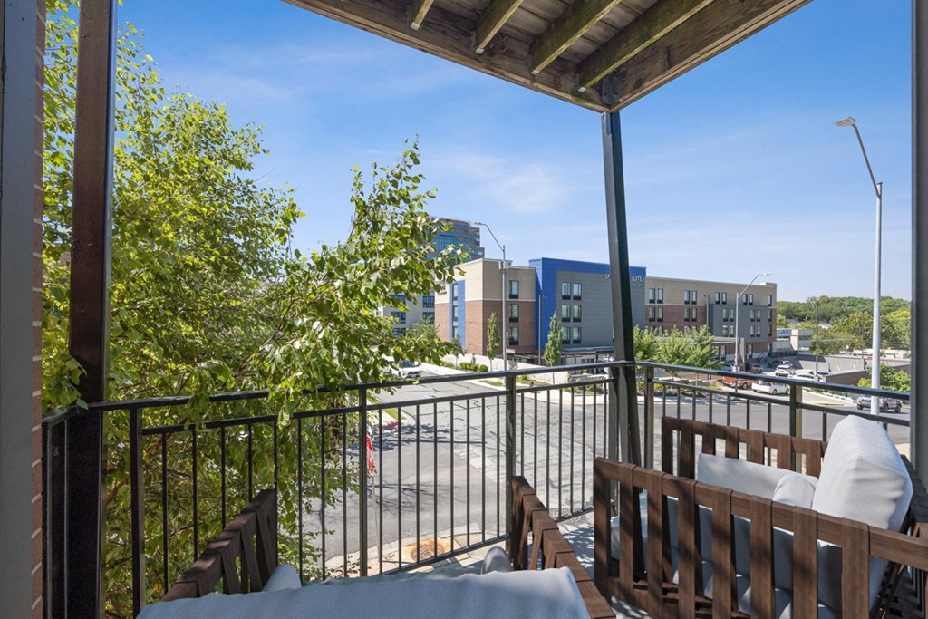Balcony with a View of a City Street and a Deck with Furniture at 45 Madison Apartments, Missouri, 64111