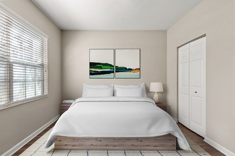Bedroom with white bedding and modern artwork at Citrus Tower Apartments, Clermont, 34711