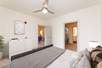 A bedroom with a large bed and a ceiling fan at Circ Apartments, Richmond, Virginia