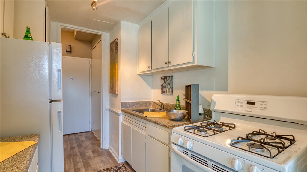 Kitchen with white fixtures at The Lafayette, Norfolk, Virginia