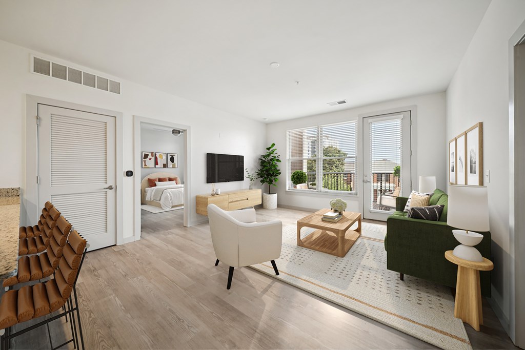 A modern living room with a white sofa and a wooden coffee table.