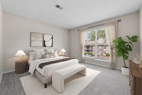 Primary bedroom with large windows, plush carpeting and abundant natural light at Edgemont Apartments, PRG Real Estate, Greenville, 29615