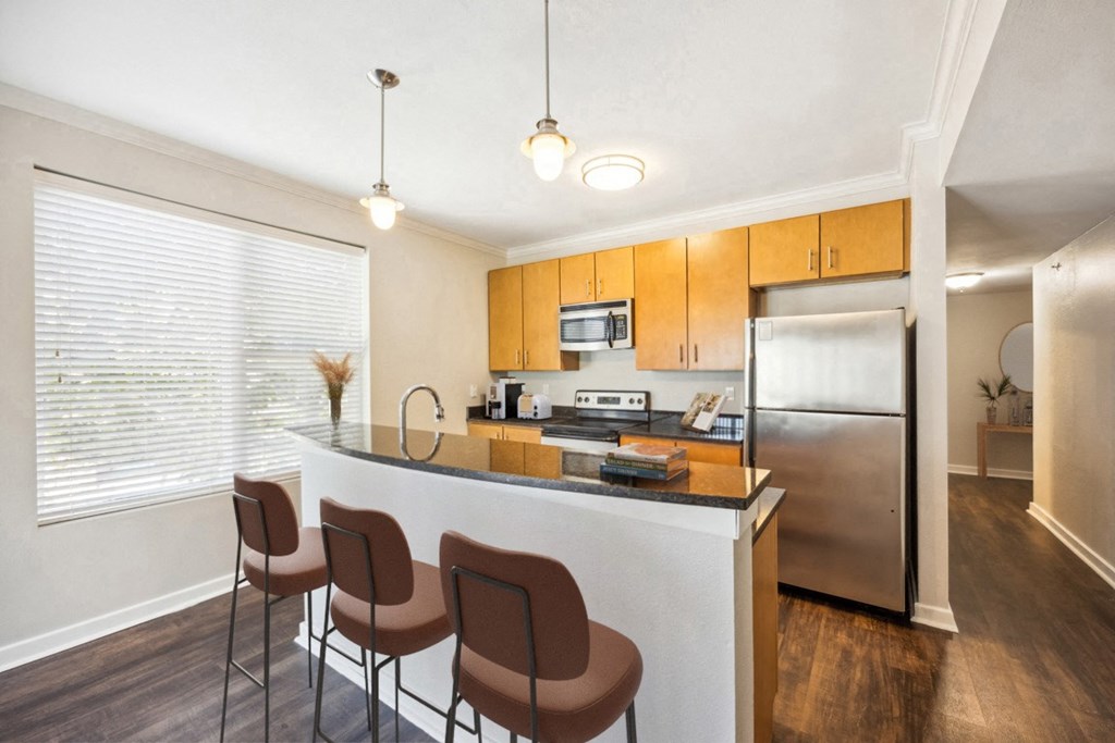 Kitchen with Bar and Yellow Furniture at 45 Madison Apartments, Missouri, 64111