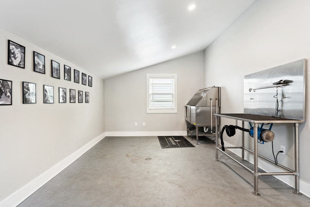 a room with a table and a grill in it at Linkhorn Bay Apartments, Virginia Beach