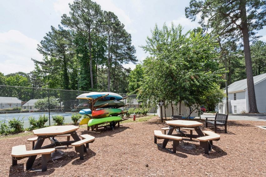 our apartments have a community picnic area with tables and chairs our apartments have a community picnic area with tables and chairs at Lake Johnson Mews, Raleigh, North Carolina