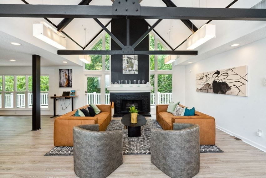 a living room with couches and chairs in front of a fireplace - Photo Gallery