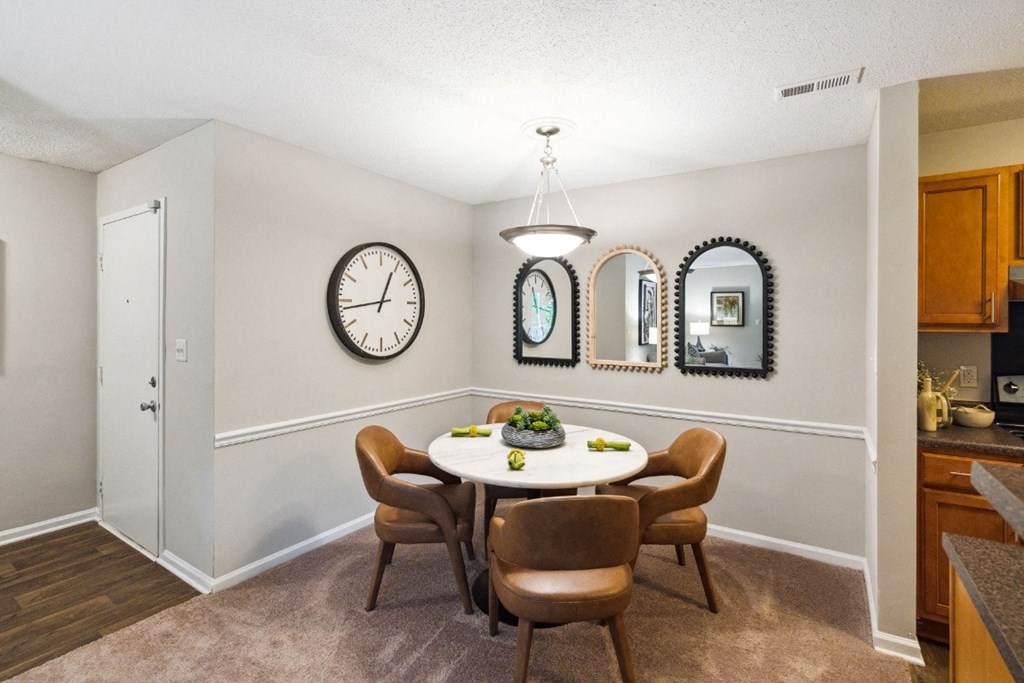 a dining room with a table and chairs a dining room with a table and chairs at Park Ridge Estates, Durham, NC