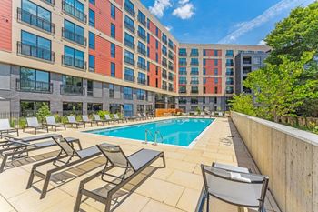 a swimming pool in front of a building with a pool at Hydro, Richmond, VA