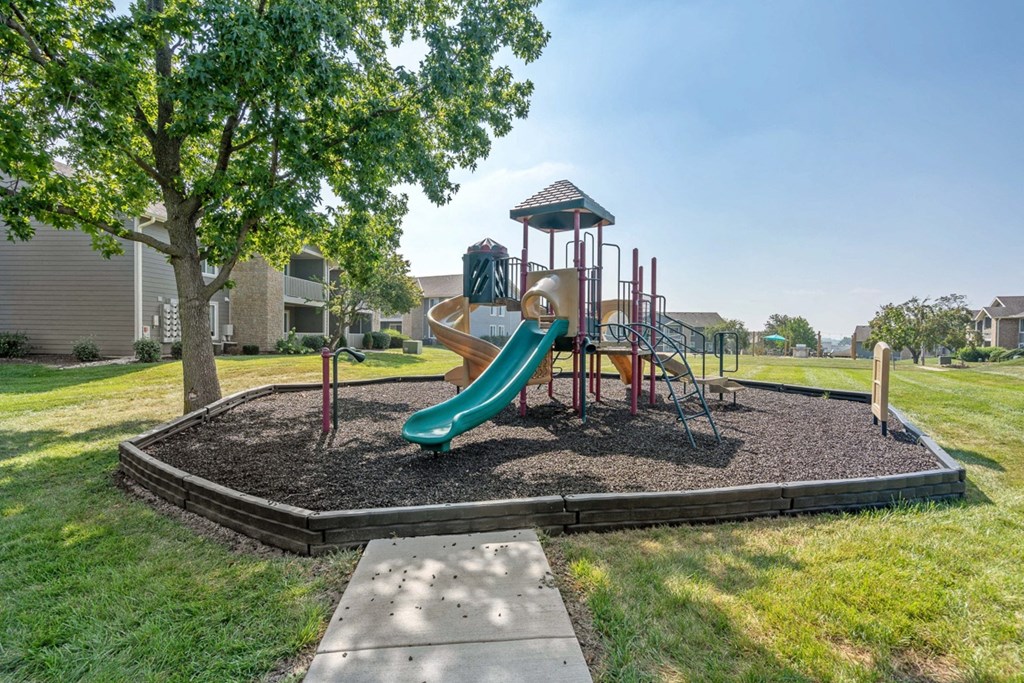 Playground with Slide at The Reserve At Barry Apartments, Kansas City, Missouri