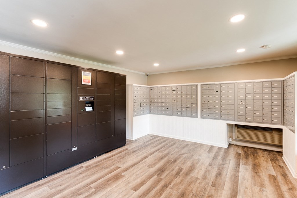 a lockers room with wooden floors and white walls at Woodcreek Apartments, Cary, North Carolina 27511